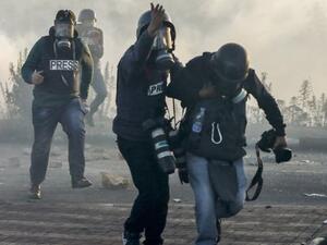 Journalists under fire (Abbas Momani/ AFP File Photo)