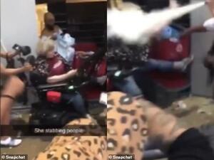 The woman claimed she was 'peacefully protesting' to stop people from looting a Target store, but she was quickly set upon by a crowd who said she had a knife. (Snapchat)