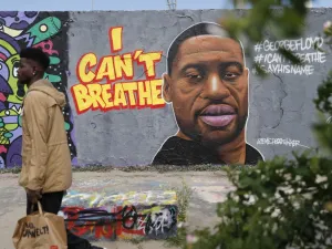 A graffiti depicting a portrait of George Floyd, a black man who died in Minneapolis after a white policeman kneeled on his neck for several minutes is seen in Berlin's Mauer Park on May 30, 2020. Odd ANDERSEN / AFP