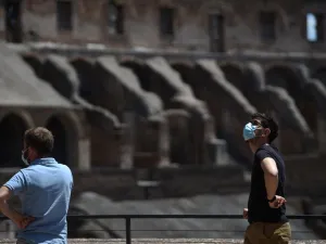 Visitors view the Colosseum monument which reopens to the public on June 1, 2020 in Rome, while the country eases its lockdown aimed at curbing the spread of the COVID-19 infection, caused by the novel coronavirus. The Colosseum monument reopens on June 1, 2020 after having been closed since March 8, 2020, with adequate sanitary protection for staff and visitors, secure routes, compulsory reservations and modified schedules to avoid crowds at peak times. Filippo MONTEFORTE / AFP
