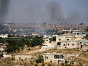 This picture taken on June 4, 2020 shows smoke plumes rising following shelling by pro-Syrian government forces in the town of Banin, north of Maaret al-Numan in Syria's northwestern Idlib province. Abdulaziz KETAZ / AFP