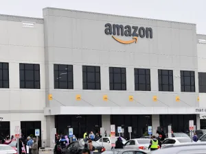 In this file photo taken on March 30, 2020, Amazon workers at Amazon's Staten Island warehouse strike in demand that the facility be shut down and cleaned after one staffer tested positive for the coronavirus in New York. (AFP/File)