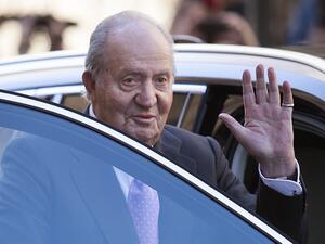 In this file photo taken on April 1, 2018 former King Juan Carlos I of Spain waves as he leaves after attending the traditional Easter Sunday Mass of Resurrection in Palma de Mallorca. The Spanish Supreme Court announced on June 8, 2020 the opening of an investigation to establish whether former King Juan Carlos has criminal responsibility in an alleged corruption case when Saudi Arabia entrusted the construction of the Mecca TGV to a Spanish consortium. JAIME REINA / AFP