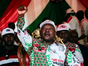 In this file photo taken on May 16, 2020 Burundi’s incumbent president Pierre Nkurunziza raises his fist as he reacts to supporters during the last campaign rally of the candidate of the ruling party the National Council for the Defense of Democracy - Forces for the Defense of Democracy (CNDD-FDD), in Bujumbura. (AFP/File)