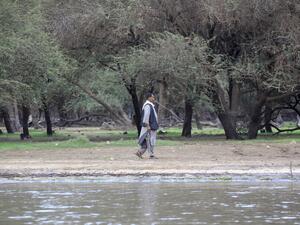 A man walks on the shore of the Nile river in the Sudanese capital Khartoum on June 9, 2020. ASHRAF SHAZLY / AFP