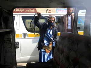 A Yemeni worker sprays disinfectant inside a van used for public transportation in the capital Sanaa, during the ongoing novel coronavirus pandemic crisis, on June 10, 2020. MOHAMMED HUWAIS / AFP