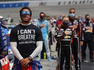 In this file photo taken on June 06, 2020 Bubba Wallace, driver of the #43 McDonald's Chevrolet, wears a "I Can't Breath - Black Lives Matter" T-shirt under his fire suit in solidarity with protesters around the world taking to the streets after the death of George Floyd on May 25. (AFP/File)