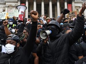 Protesters gather in support of the Black Lives Matter movement for a protest action in Trafalgar Sqaure in central London on June 13, 2020, in the aftermath of the death of unarmed black man George Floyd in police custody in the US. Police in London have urged people planning to attend anti-racism and counter protests on Saturday not to turn out, citing government regulations banning gatherings during the coronavirus pandemic. DANIEL LEAL-OLIVAS / AFP