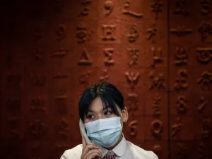 This photo taken on June 14, 2020 shows a staff member talking in the phone at Hubei Libruary as it reopens to the public in Wuhan in China's central Hubei province. STR / AFP