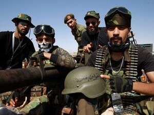 Members of the self-proclaimed eastern Libyan National Army (LNA) special forces gather in the city of Benghazi, on their way to reportedly back up fellow LNA fighters on the frontline west of the city of Sirte, facing forces loyal to the UN-recognised Government of National Accord (GNA), on June 18, 2020. The resurgent GNA has vowed to push on for Sirte, late Libyan leader Moamer Kadhafi's hometown and the last major settlement before the traditional boundary between western Libya and Haftar's stronghold i