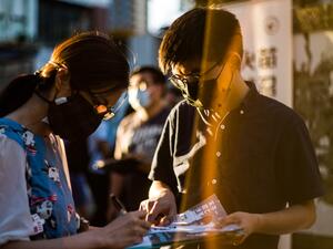 Pro-democracy activist Joshua Wong (R) stands next to a supporter after he announced his plan to run for the upcoming Legislative Council elections in Hong Kong on June 19, 2020. Anthony WALLACE / AFP
