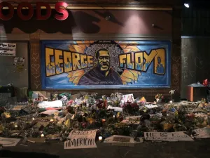 Candles burn at a memorial at the spot where George Floyd was killed, on June 1, 2020 in Minneapolis, Minnesota. With 7,500 national guard troops called up to supplement state and local police, this is the largest domestic deployment of national guard in the state's history. (AFP/File Photo)