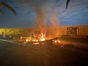 A picture published by the media office of the Iraqi military's joint operations forces on their official Facebook page shows a destroyed vehicle on fire following a US strike on January 3, 2020 on Baghdad international airport road. (File/AFP)