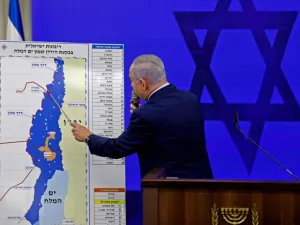 Growing appetite for lands. Israeli Prime Minister Binyamin Netanyahu points at a map of the Jordan Valley as he gives a statement in Ramat Gan near Tel Aviv, September 10. (AFP)