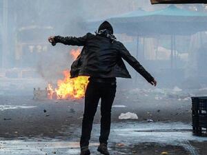 Clashes between Turkish forces and Kurdish people in Diyarbakir, during protest against curfew (AFP)