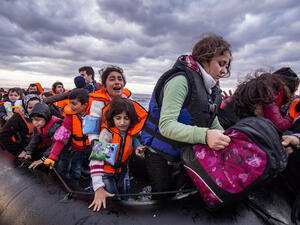 Syrian migrants / refugees arrive from Turkey on boat through sea with cold water near Molyvos, Lesbos. (Shutterstock/ File Photo)