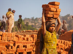 A young girl working in a brick factory  (Shutterstock)