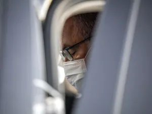 Israeli Prime Minister Benjamin Netanyahu, clad in mask due to the COVID-19 coronavirus pandemic, sits in his car after attending a graduation ceremony for new pilots in Hatzerim air force base near the southern Israeli city of Beersheba, on June 25, 2020. Ariel Schalit / POOL / AFP