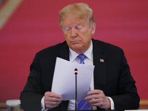 In this file photo taken on June 26, 2020 US President Donald Trump looks on during an American Workforce Policy Advisory Board Meeting in the East Room of the White House in Washington, DC. Donald Trump received a written briefing about alleged Russian bounties offered to Afghan militants to kill American troops as early as February, The New York Times said on June 29, 2020 in a new report undercutting the US president's assertion that he was not told of the threat. MANDEL NGAN / AFP