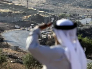 A Palestinian shepherd stands near the Israeli Hamra checkpoint, which separates the areas of the Palestinian Authority classified A and classified B in the Jordan Valley east of Nablus on July 1, 2020. The Oslo Agreements on self-rule signed by the Israelis and Palestinians in the 1990s divide the West Bank into Areas A, B and C. Area C, under full Israeli control, constitutes some 60 percent of the West Bank. The settlements and parts of the Jordan Valley that Israel seeks to annex are mainly in Area C. T
