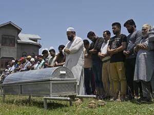 Relatives and neighbours offer funeral prayers for Bashir Ahmed, a civilian who died during a gun-battle between government forces and suspected militants, in Srinagar on July 1, 2020. TAUSEEF MUSTAFA / AFP