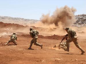 Members of Syria's opposition National Liberation Front take part in a military training in the northern countryside of Idlib province, on July 1, 2020. AAREF WATAD / AFP