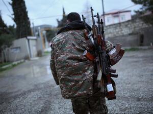 In this file photo taken on April 4, 2016, a soldier of the self-defence army of Nagorno-Karabakh carries weapons in the Martakert region. Azerbaijan on July 7, 2020, raised the spectre of a fresh war with arch-foe Armenia and denounced stalled peace talks over the disputed Nagorny Karabakh region. The two ex-Soviet republics have for decades been locked in a simmering conflict over the breakaway territory, which was at the heart of a bloody war in the 1990s. Vahan Stepanyan / PAN Photo / AFP