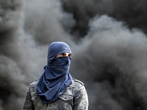 A Palestinian demonstrator is pictured during clashes following the funeral of 29-year-old Palestinian Ibrahim Abou Yacoub, who was killed by Israeli forces, in the village of Kifl Hares, south of the West Bank city of Nablus on July 10, 2020. JAAFAR ASHTIYEH / AFP