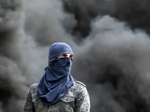 A Palestinian demonstrator is pictured during clashes following the funeral of 29-year-old Palestinian Ibrahim Abou Yacoub, who was killed by Israeli forces, in the village of Kifl Hares, south of the West Bank city of Nablus on July 10, 2020. Israeli troops killed a Palestinian civilian in the West Bank on July 9, the Palestinian health ministry said. The ministry did not give any details as to the circumstances of the killing, stating only that "a civilian was killed by Israeli forces" after being shot in