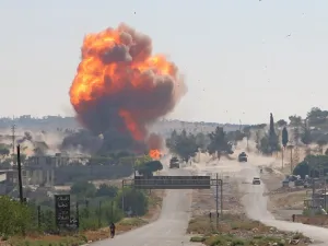 A fireball erupts from the site of an explosion reportedly targeting a joint Turkish-Russian patrol on the strategic M4 highway, near the Syrian town of Ariha in the rebel-held northwestern Idlib province, on July 14, 2020. Mohammed AL-RIFAI / AFP
