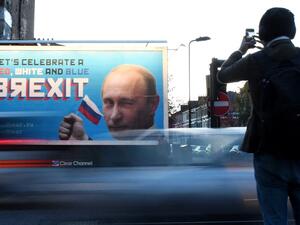 In this file photo taken on November 08, 2018 A Brexit-themed billboard depicting Russian President Vladimir Putin that reads "Lets celebrate a red, white and blue Brexit" is seen in north London on November 8, 2018. Britain on Thursday accused "Russian actors" of seeking to disrupt last year's general election by circulating leaked trade documents between London and Washington. Parliament's Intelligence and Security Committee (ISC) had launched a probe into suspicions of Russian interference in the 2016 Br