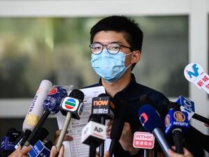 Pro-democracy activist Joshua Wong speaks to the press as he announces his intention to run for the Legislative Council general election in Hong Kong on July 20, 2020. ANTHONY WALLACE / AFP
