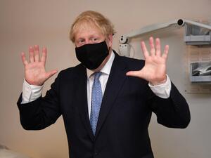 Britain's Prime Minister Boris Johnson gestures during his visit to the Tollgate Medical Centre in Becton, east London on July 24, 2020..   Jeremy Selwyn / POOL / AFP