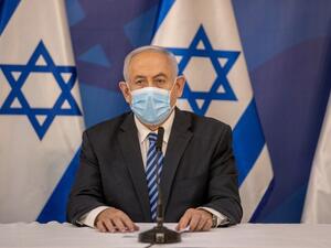 Israeli Prime Minister Benjamin Netanyahu wears a protective face mask before issuing a statement at the Israeli Defence Ministry in Tel Aviv on July 27, 2020 following the high tensions with the Lebanese militant group Hezbollah at the Israeli-Lebanon border. Tal SHAHAR / POOL / AFP