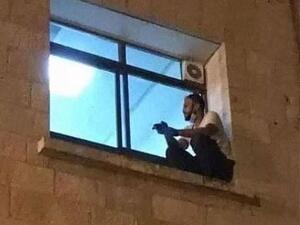 A moving photo shows Jihad sitting on the window ledge. (Facebook)