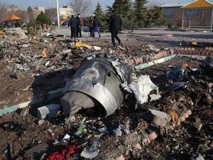 Rescue teams work amidst debris after a Ukrainian plane crashed near Imam Khomeini airport in Tehran. (File photo/ AFP)