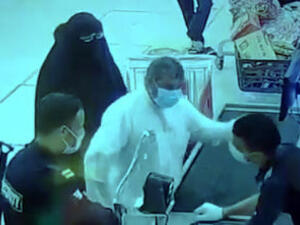 The attacker slapping a worker across the face at the Sabah Al-Ahmad cooperative supermarket. (Twitter/ Video Screenshot)