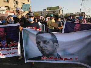 Mourners attend a symbolic funeral for slain Iraqi jihadism expert Hisham al-Hashemi in Baghdad on July 7, 2020.PHOTO: AFP