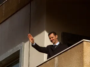 The Syrian President Bashar al Assad waves to his supporters during a pro government demonstration in the center of Damascus, Syria. (Shutterstock/ File Photo)