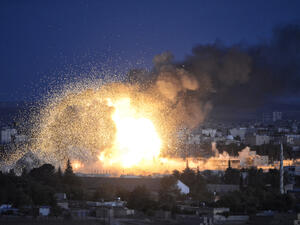An explosion after an apparent US-led coalition airstrike on Kobane, Syria. (Shutterstock/ File Photo)