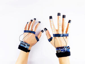 A word, phrase or letter in American Sign Language and transmits them wirelessly to a smartphone app that translates them at a rate of one word per second. (Shutterstock/ File Photo)