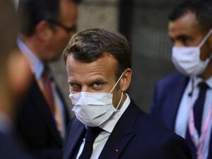 French President Emmanuel Macron, center, leaves the European Council building in the early morning during an EU summit in Brussels, on July 20, 2020. Olivier Matthys / POOL / AFP