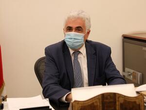Lebanon's Foreign Minister Nassif Hitti is pictured wearing a face mask due to the coronavirus in his office in the capital Beirut, on August 3, 2020. Hitti announced his resignation today due to the government's mishandling of the country's worst crisis in decades, as premier Hasan Diab's under-fire cabinet struggles to secure international support. ANWAR AMRO / AFP