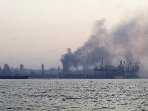 A picture taken from the coastal road on the northern outskirts of Beirut shows smoke billowing following an explosion in the heart Lebanese capital on August 4, 2020. Two huge explosion rocked the Lebanese capital Beirut, wounding dozens of people, shaking buildings and sending huge plumes of smoke billowing into the sky. Lebanese media carried images of people trapped under rubble, some bloodied, after the massive explosions, the cause of which was not immediately known.  JOSEPH EID / AFP