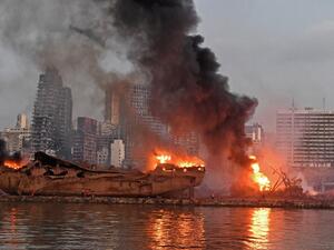 A ship is pictured engulfed in flames at the port of Beirut following a massive explosion that hit the heart of the Lebanese capital on August 4, 2020. Rescuers searched for survivors in Beirut on August 5 after a cataclysmic explosion at the port sowed devastation across entire neighbourhoods, killing more than 100 people, wounding thousands and plunging Lebanon deeper into crisis. AFP