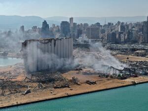 An aerial view shows the massive damage done to Beirut port's grain silos (C) and the area around it on August 5, 2020, one day after a mega-blast tore through the harbour. AFP