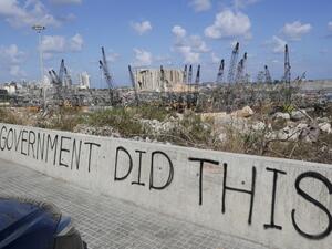 A picture taken on August 9, 2020, shows graffiti on the wall of a bridge overlooking the port of Beirut, the site of the explosion which killed at least 154 people and devastated swathes of the capital. ANWAR AMRO / AFP