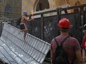 Lebanese protesters, enraged by a deadly explosion blamed on officials' negligence, clash with security forces for the second evening near an access street to the parliament in central Beirut, on August 9, 2020. JOSEPH EID / european afp / AFP