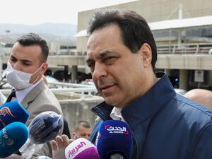 In this file photo taken on April 5, 2020 Lebanese Prime Minister Hassan Diab speaks to the media outside the Beirut international airport. Diab was expected to announce his government's resignation on August 10, 2020 amid popular outrage over the deadly Beirut port explosion that has reignited angry street protests. ANWAR AMRO / AFP