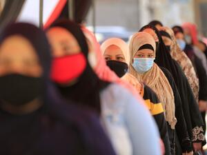 Egyptians wearing face masks against Covid-19 queue up to vote on August 11, 2020 for a new senate in an upper house election. The two-day vote for 200 of the Senate's 300 seats will be largely contested by candidates who back President Abdel Fattah al-Sisi, who has quietened most opposition within and outside the legislature.  Khaled DESOUKI / AFP